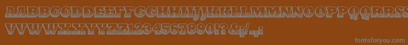 PrintOldyz-fontti – harmaat kirjasimet ruskealla taustalla
