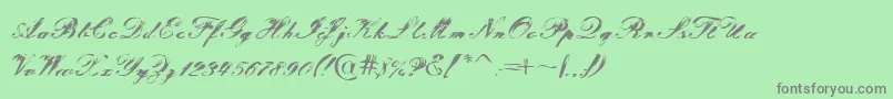 フォントTragedia – 緑の背景に灰色の文字