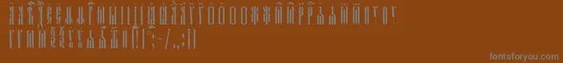 KathismaUcsSpacedout Font – Gray Fonts on Brown Background