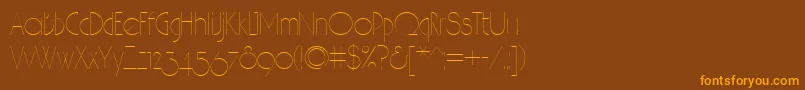 フォントHair – オレンジ色の文字が茶色の背景にあります。