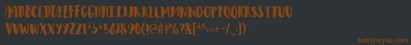 Observantdemo-fontti – ruskeat fontit mustalla taustalla