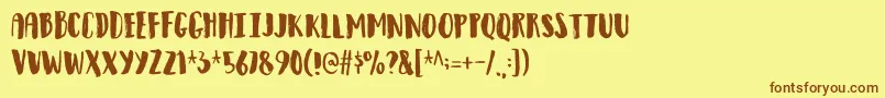 フォントObservantdemo – 茶色の文字が黄色の背景にあります。