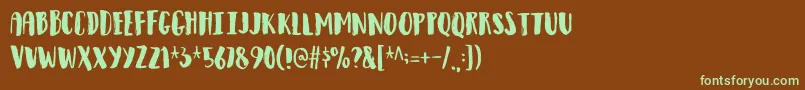 フォントObservantdemo – 緑色の文字が茶色の背景にあります。