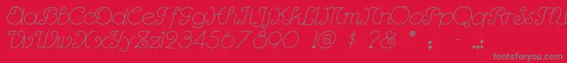 Rhumbasc-fontti – harmaat kirjasimet punaisella taustalla