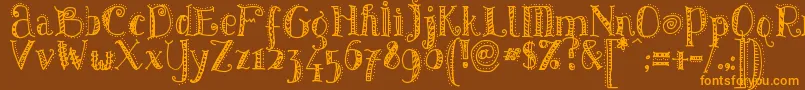 PatternsDots Font – Orange Fonts on Brown Background