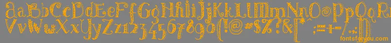 PatternsDots-Schriftart – Orangefarbene Schriften auf grauem Hintergrund