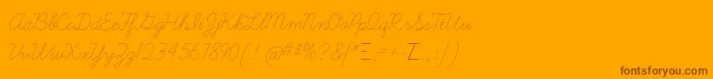 Czcionka LearningcurvedashedTt – brązowe czcionki na pomarańczowym tle