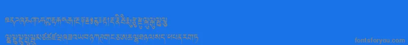 Tibetanmachineweb-Schriftart – Graue Schriften auf blauem Hintergrund