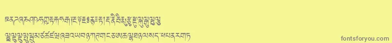 Fonte Tibetanmachineweb – fontes cinzas em um fundo amarelo