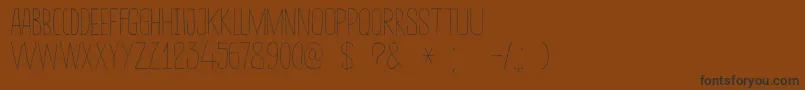 DkSucoDeLaranja Font – Black Fonts on Brown Background