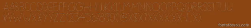 DkSleepyTime-fontti – harmaat kirjasimet ruskealla taustalla