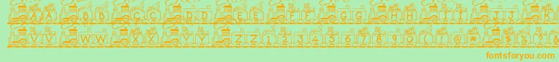 フォントToyTrain – オレンジの文字が緑の背景にあります。