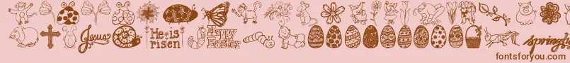 フォントJandaspringdoodles – ピンクの背景に茶色のフォント