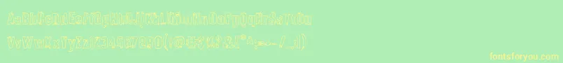 フォントQuarrystoneout – 黄色の文字が緑の背景にあります