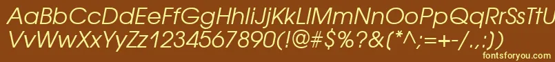 AvantgardegothicattItalic-fontti – keltaiset fontit ruskealla taustalla