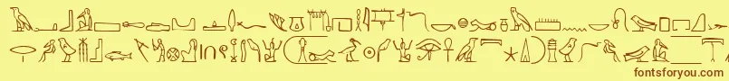 NahktHieroglyphs-fontti – ruskeat fontit keltaisella taustalla