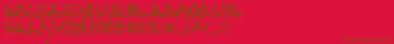 Anakanak-Schriftart – Braune Schriften auf rotem Hintergrund