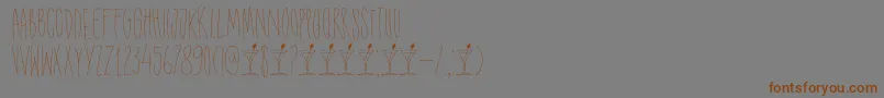 DkShakenNotStirredフォントについての詳細 フォントDkShakenNotStirred – 茶色の文字が灰色の背景にあります。