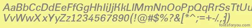 Groti11-fontti – harmaat kirjasimet keltaisella taustalla