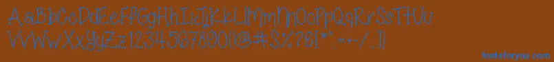 MissSmartyPantsSkinny Font – Blue Fonts on Brown Background