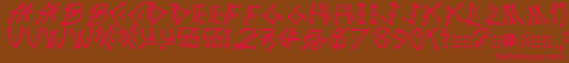 フォントNuttycaptain – 赤い文字が茶色の背景にあります。