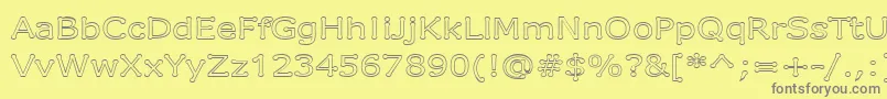 DrummonOutline-Schriftart – Graue Schriften auf gelbem Hintergrund
