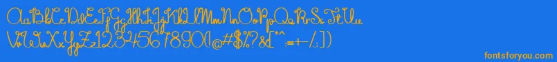 フォントTheFlowerySpring – オレンジ色の文字が青い背景にあります。