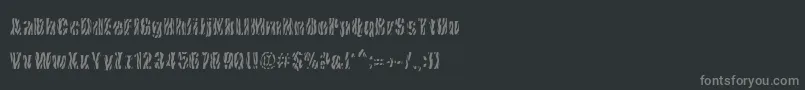 CowsInTheU.S.-fontti – harmaat kirjasimet mustalla taustalla