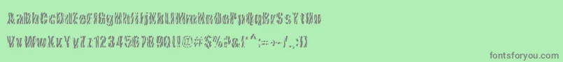 CowsInTheU.S.-Schriftart – Graue Schriften auf grünem Hintergrund