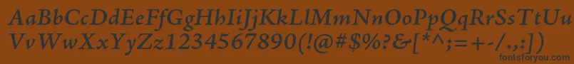 フォントAjensonproSemibolditcapt – 黒い文字が茶色の背景にあります