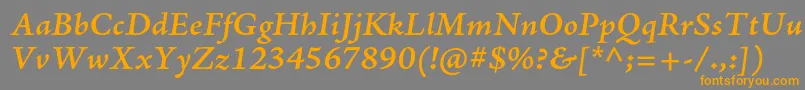 フォントAjensonproSemibolditcapt – オレンジの文字は灰色の背景にあります。