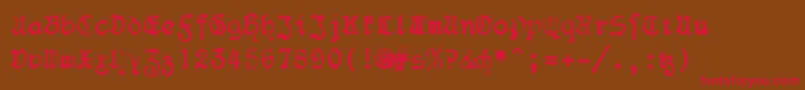 F25Blacklettertypewriter Font – Red Fonts on Brown Background