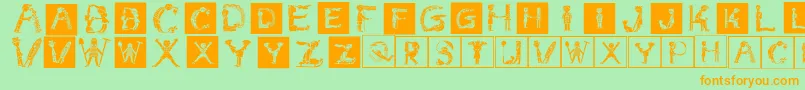 フォントChildrensalphabet – オレンジの文字が緑の背景にあります。