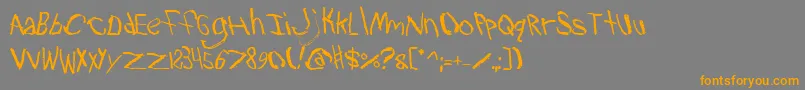 フォントTravb2 – オレンジの文字は灰色の背景にあります。