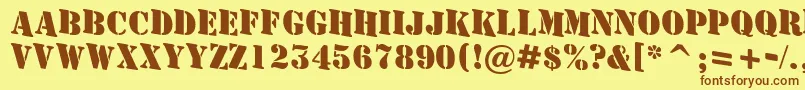 フォントAStamperdnBold – 茶色の文字が黄色の背景にあります。