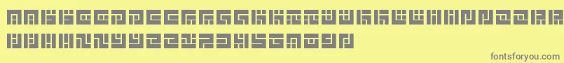 SymvolaTrio Font – Gray Fonts on Yellow Background