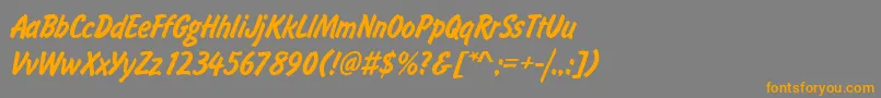 フォントFlashdlig – オレンジの文字は灰色の背景にあります。