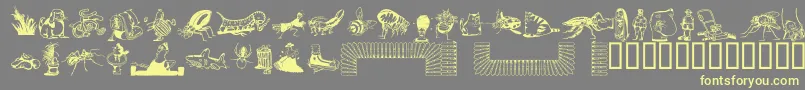 DfBackyardBeastiesttItc-fontti – keltaiset fontit harmaalla taustalla