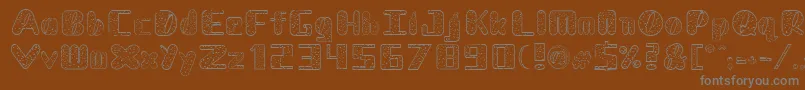 フォントNadcDalmatian – 茶色の背景に灰色の文字