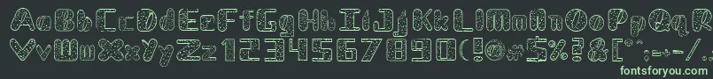 フォントNadcDalmatian – 黒い背景に緑の文字
