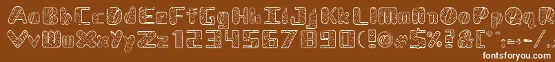 NadcDalmatian-fontti – valkoiset fontit ruskealla taustalla