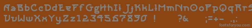 Sangha-fontti – harmaat kirjasimet ruskealla taustalla