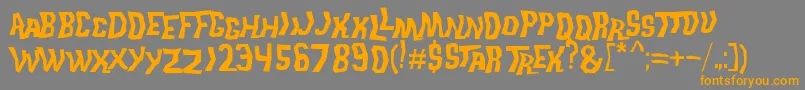 フォントTrekDisruptorBlast – オレンジの文字は灰色の背景にあります。