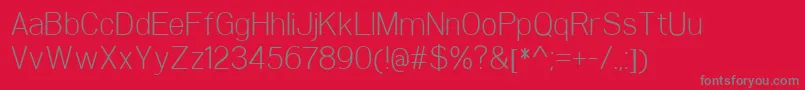 WoolworthLight-Schriftart – Graue Schriften auf rotem Hintergrund