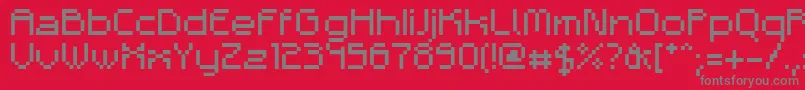 フォントAdelb – 赤い背景に灰色の文字