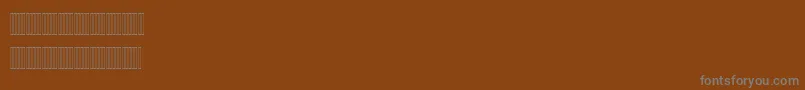 Czcionka Mariam – szare czcionki na brązowym tle