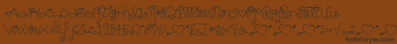 Schnookums Font – Black Fonts on Brown Background
