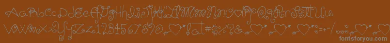 Шрифт Schnookums – серые шрифты на коричневом фоне