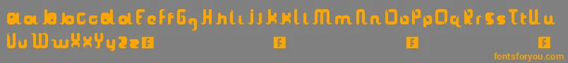 フォントTheasanti – オレンジの文字は灰色の背景にあります。