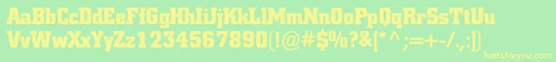 フォントColiseumblackc – 黄色の文字が緑の背景にあります